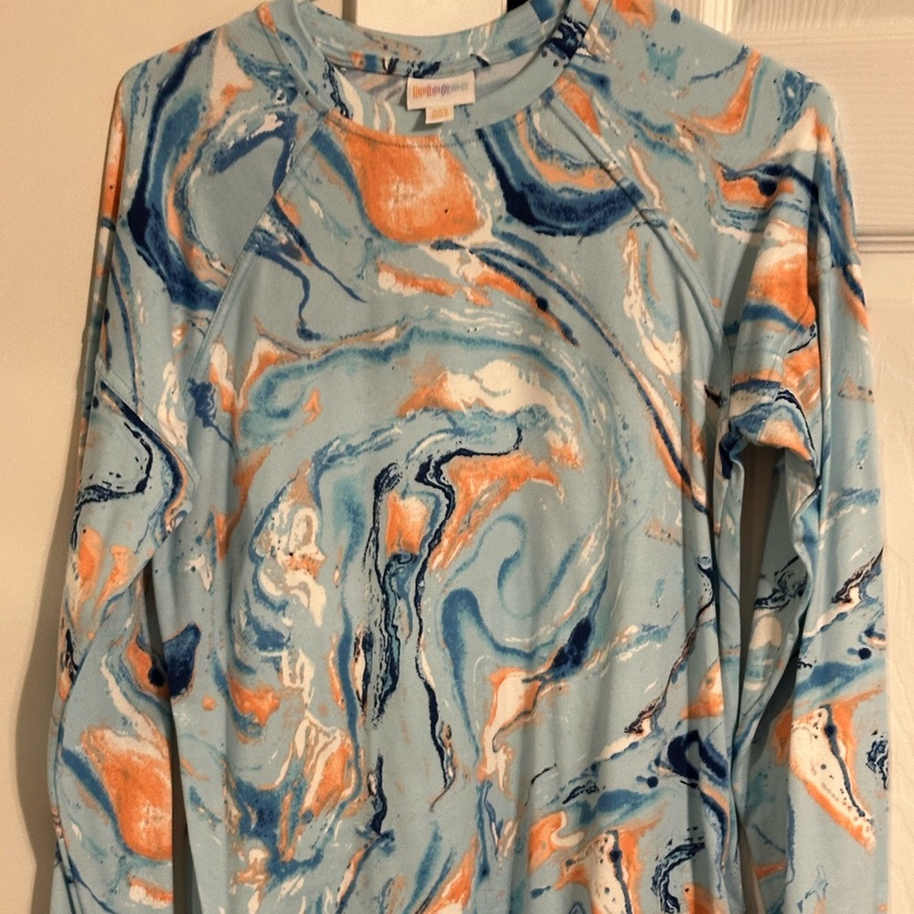Lularoe orange/blue Erin shirt. NWOT. Xxs. Very soft. Hard to find.